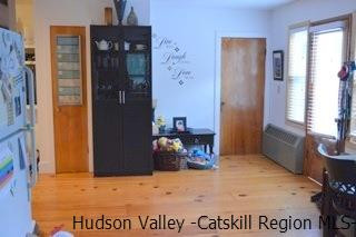 3605-3607 Atwood Road Stone Ridge, NY 12484 - Photo 3 of 19 a view of a hallway with wooden shelves