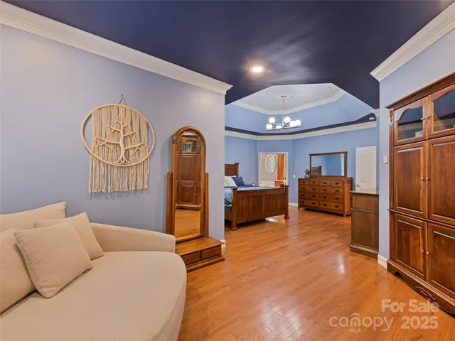 a living room with furniture a couch and dresser