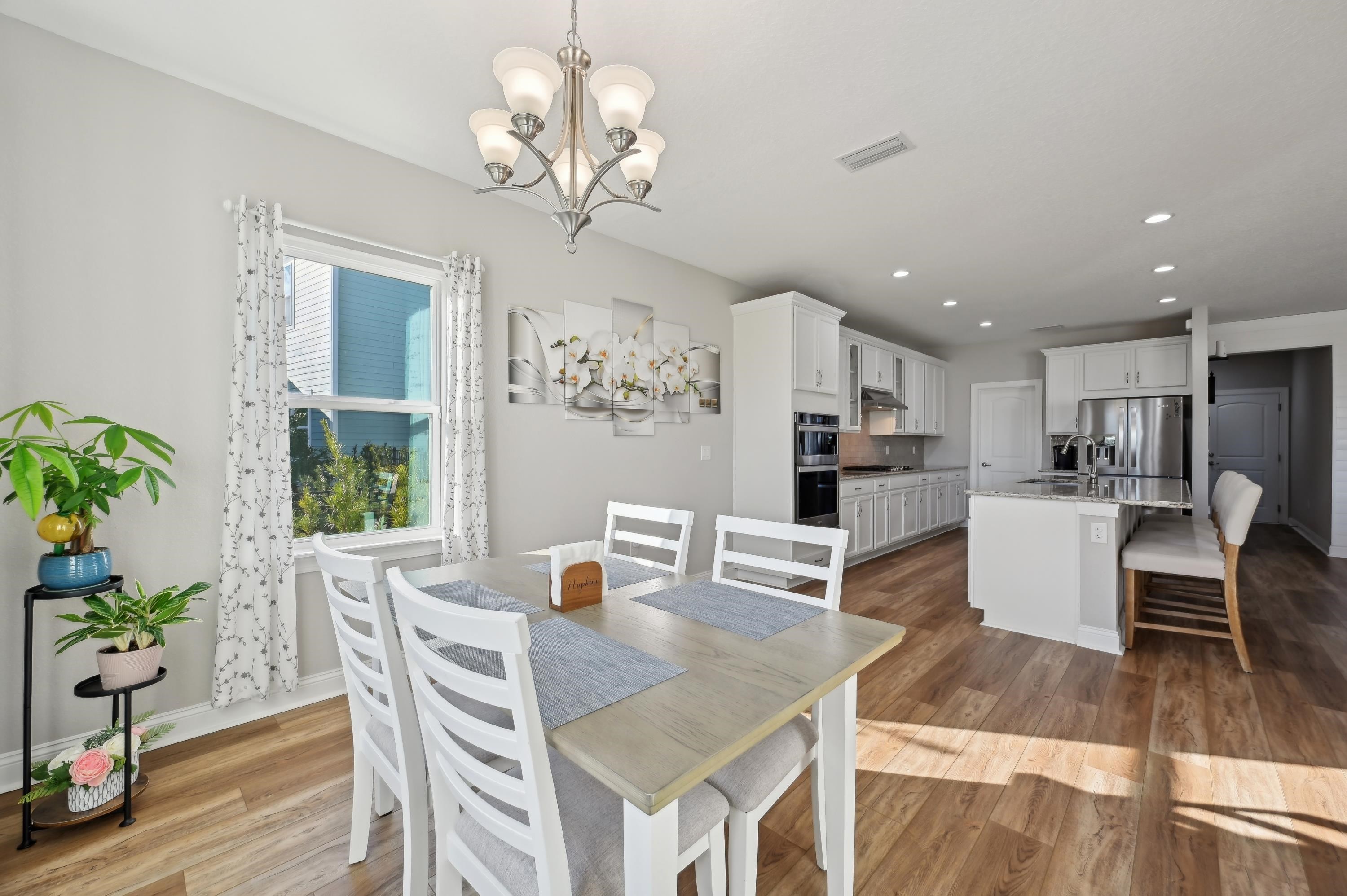 57 Sunset Ridge Court St. Johns, FL 32259 - Photo 12 of 79 Dining area featuring light wood-type flooring, a chandelier, and recessed lighting