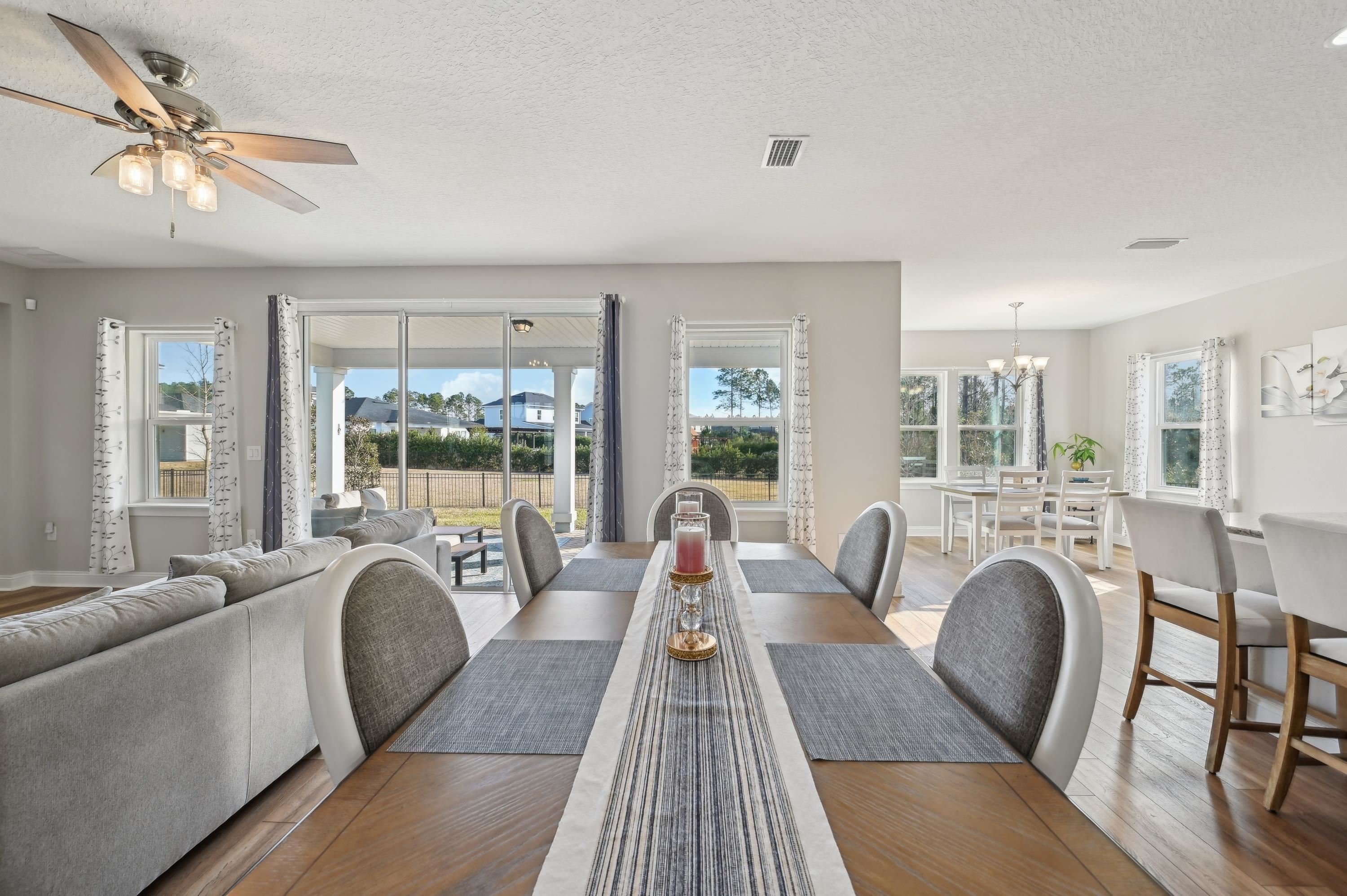 57 Sunset Ridge Court St. Johns, FL 32259 - Photo 13 of 79 Dining space with wood finished floors, a textured ceiling, healthy amount of natural light, and a chandelier