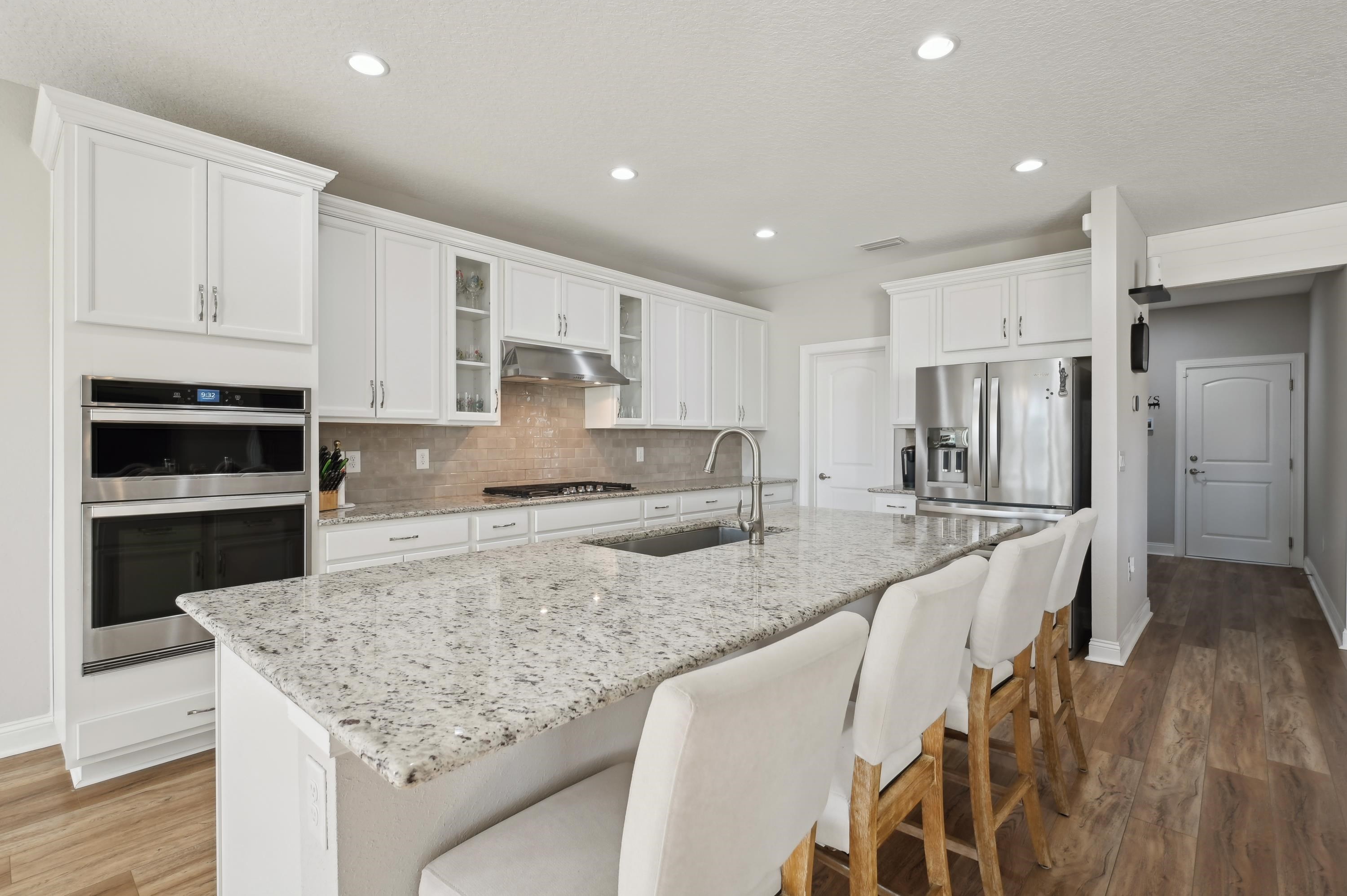 57 Sunset Ridge Court St. Johns, FL 32259 - Photo 17 of 79 a kitchen with stainless steel appliances granite countertop a stove refrigerator sink and cabinets
