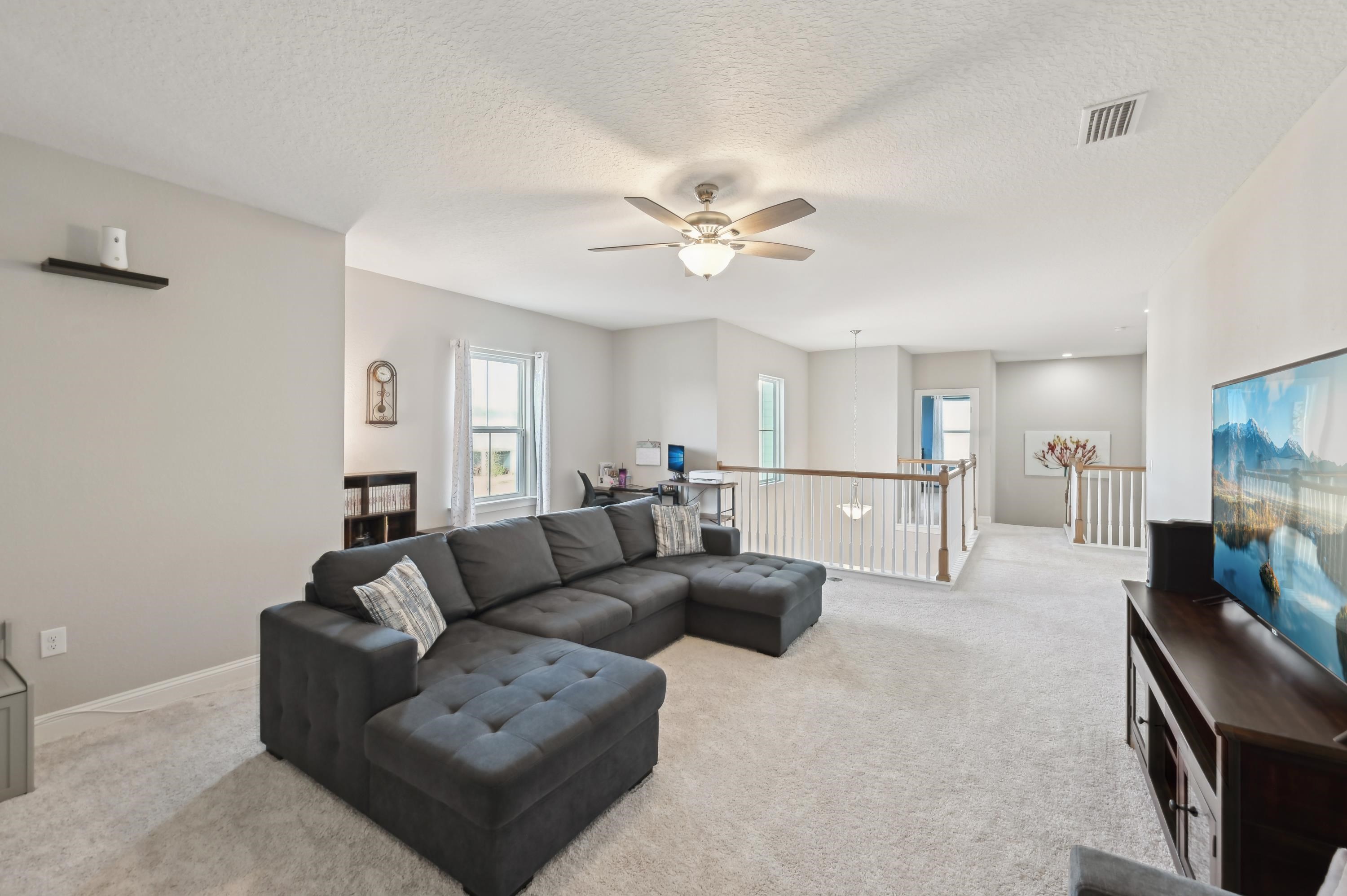 57 Sunset Ridge Court St. Johns, FL 32259 - Photo 31 of 79 a living room with furniture and a flat screen tv