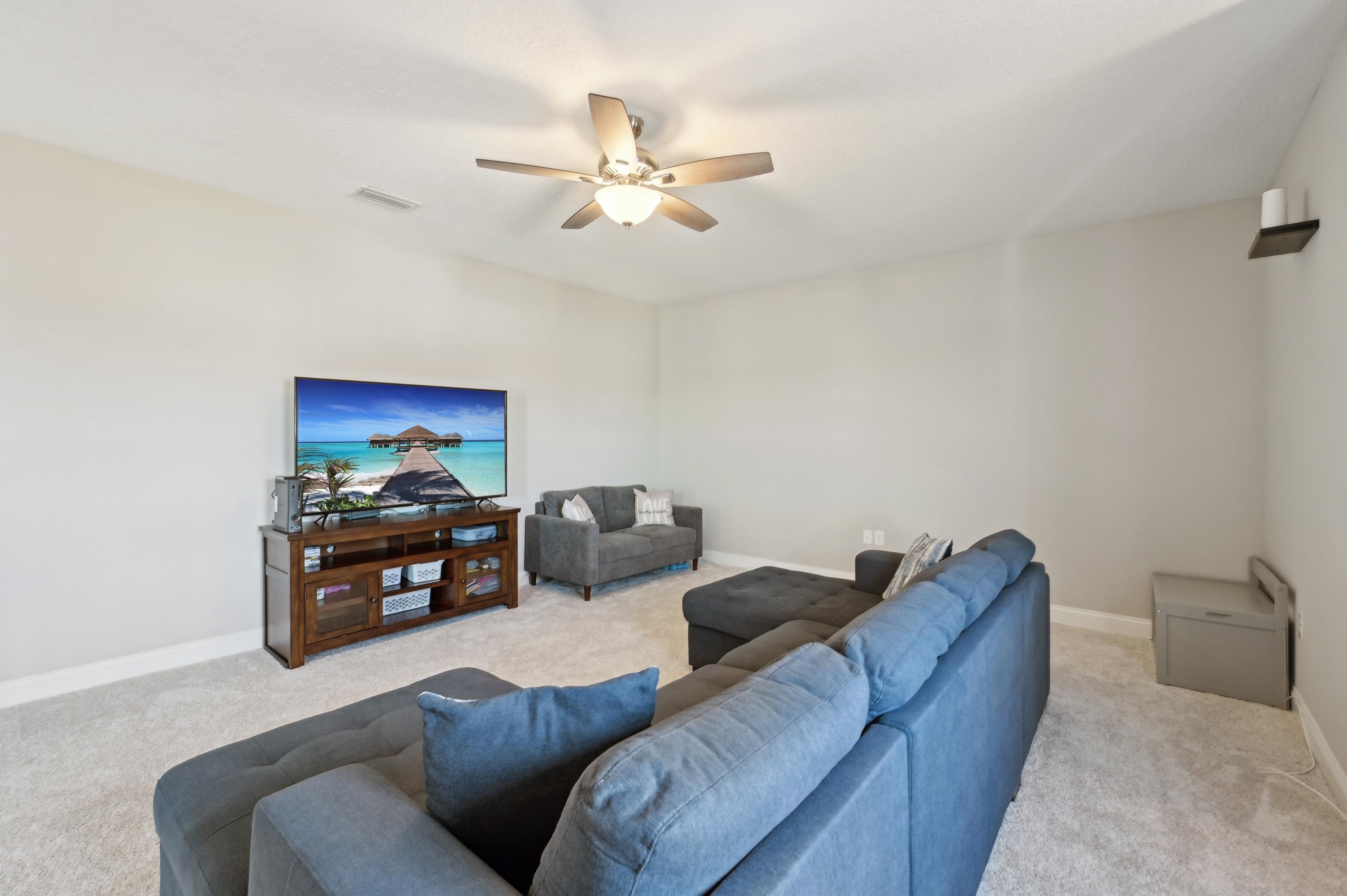 57 Sunset Ridge Court St. Johns, FL 32259 - Photo 32 of 79 a living room with furniture and a flat screen tv