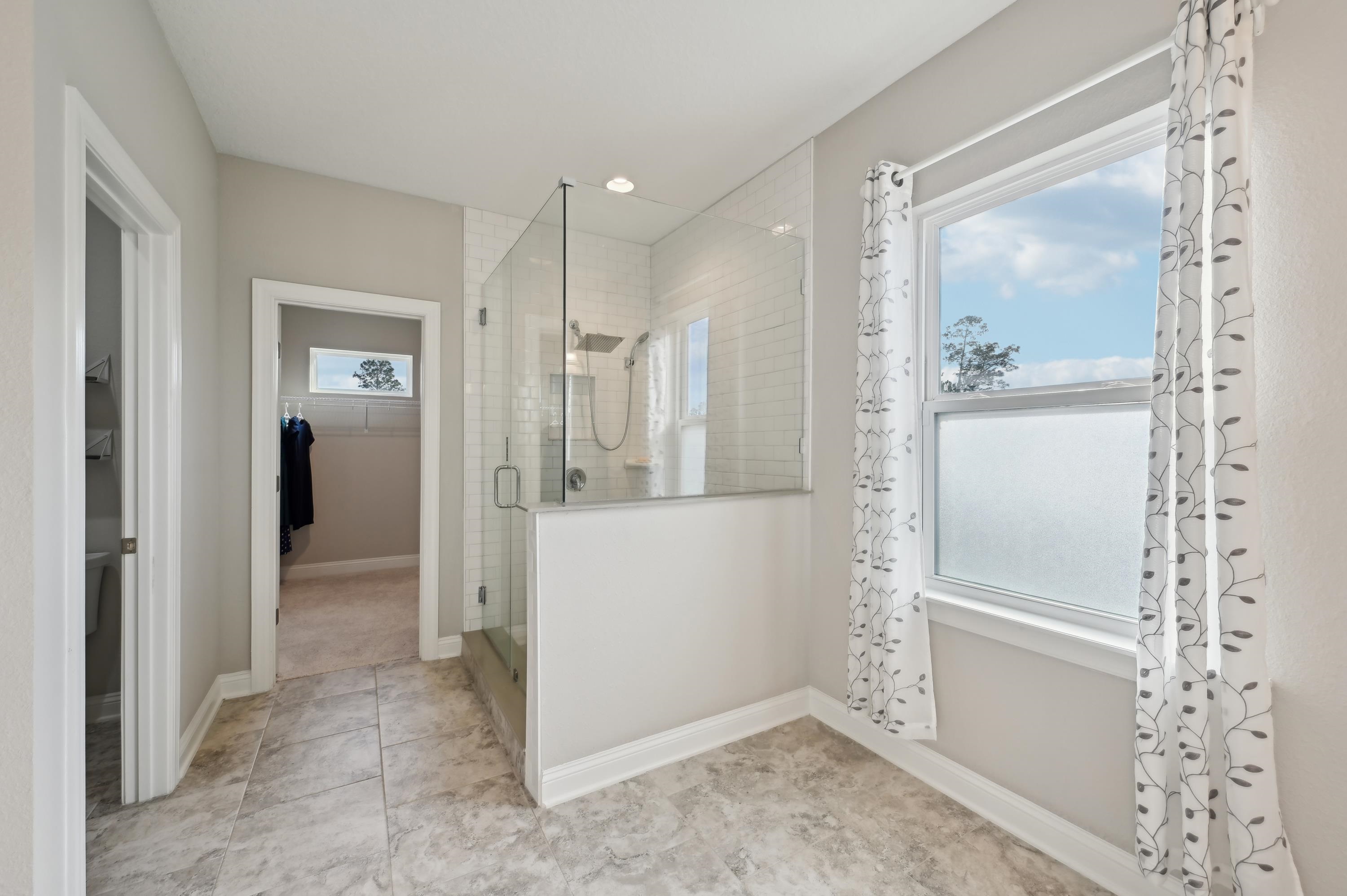 57 Sunset Ridge Court St. Johns, FL 32259 - Photo 49 of 79 Bathroom featuring a spacious closet, a shower stall, light tile patterned floors, and recessed lighting