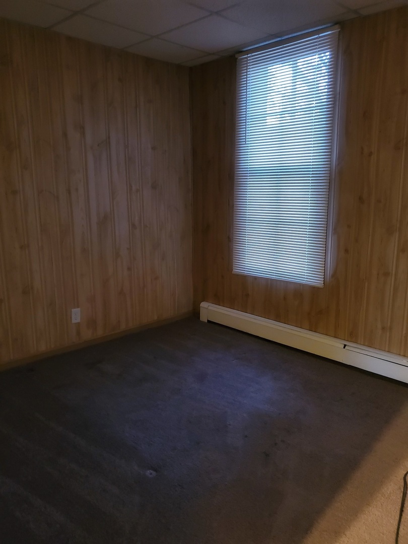 461 West Cermak Road Braidwood, IL 60408 - Photo 6 of 15 an empty room with a window