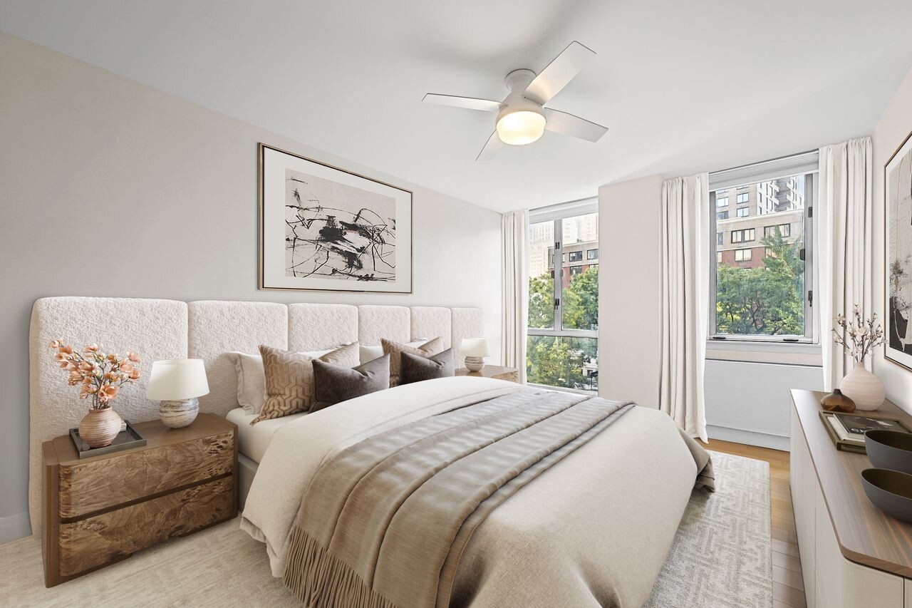 225 Rector Place, Unit 5K Manhattan, NY 10280 - Photo 10 of 12 a bedroom with bed and window