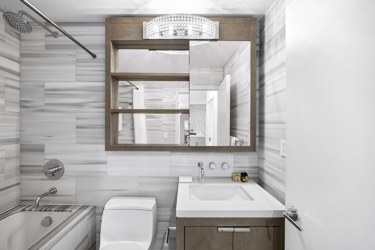 225 Rector Place, Unit 5K Manhattan, NY 10280 - Photo 5 of 12 a bathroom with a sink and a toilet