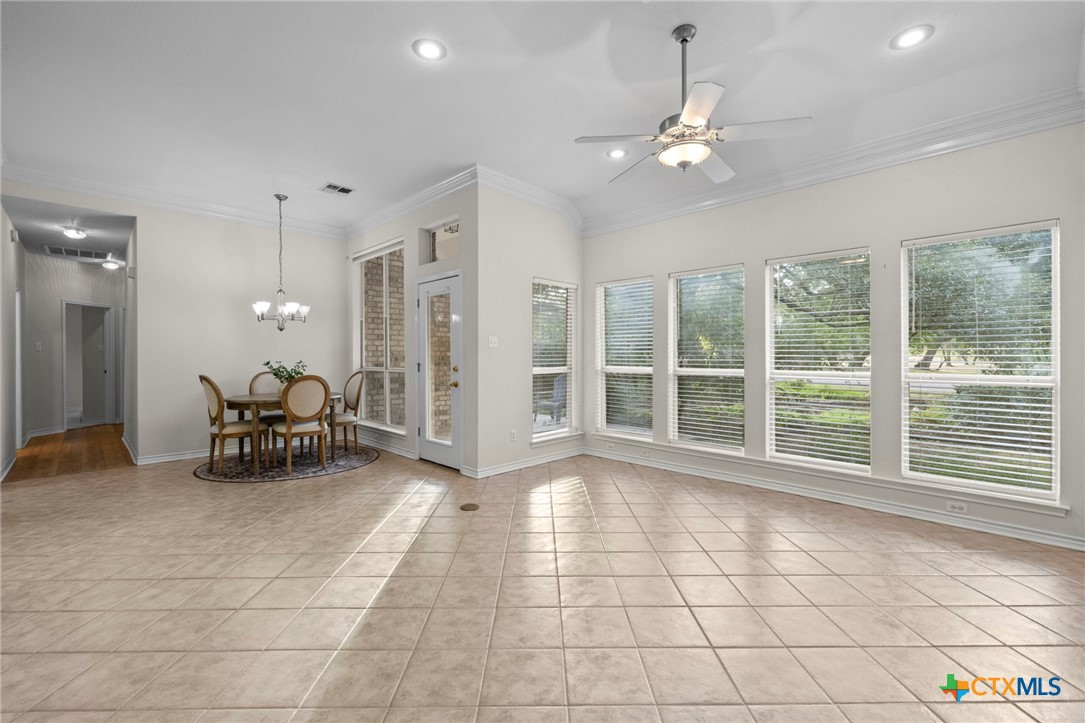 707 Livingston Court Temple, TX 76502 - Photo 14 of 36 a view of a room with gym equipment and large windows