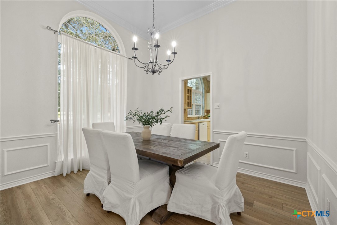 707 Livingston Court Temple, TX 76502 - Photo 16 of 36 a view of a dining room with furniture and chandelier