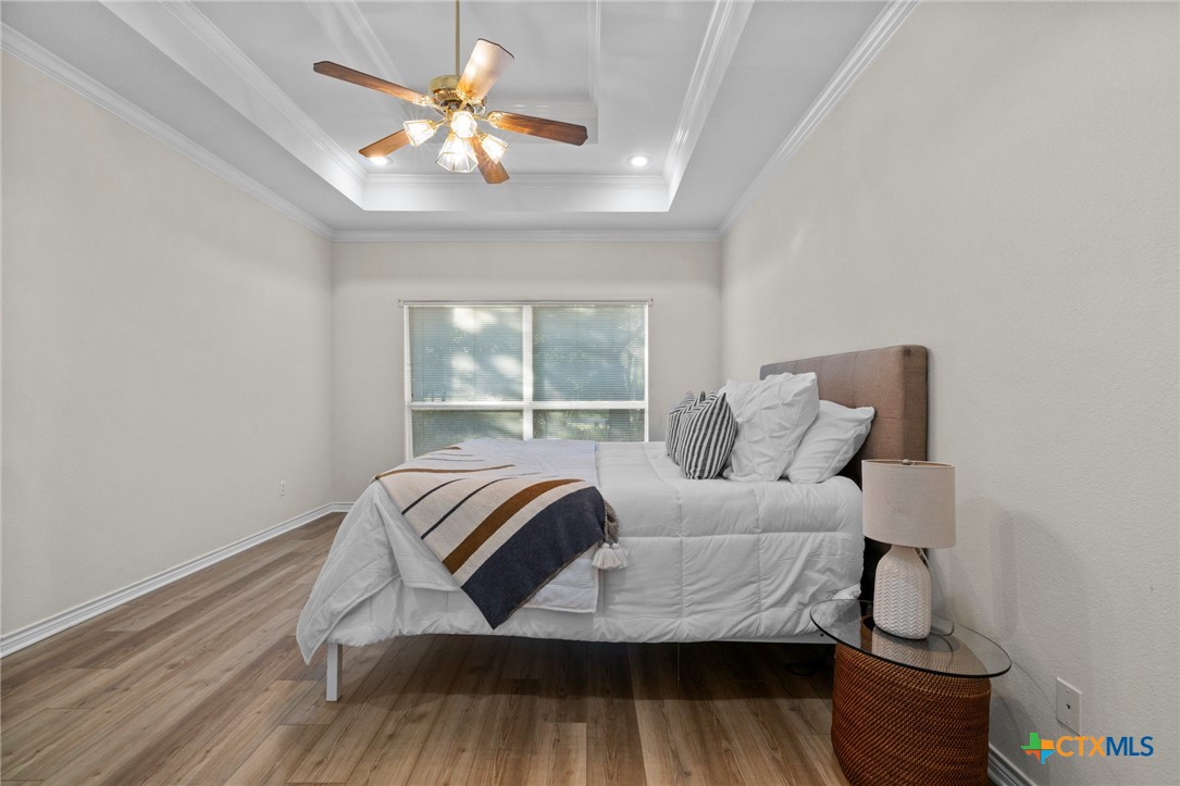 707 Livingston Court Temple, TX 76502 - Photo 19 of 36 a bedroom with a bed and window