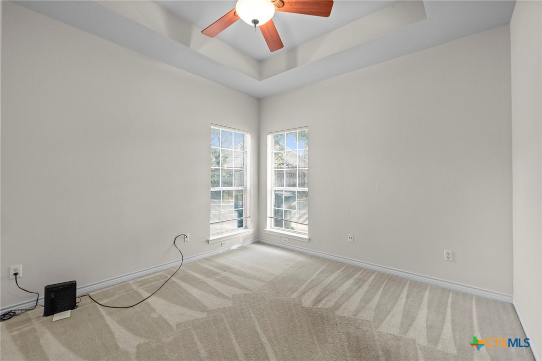 707 Livingston Court Temple, TX 76502 - Photo 27 of 36 a bedroom with a bed and a window