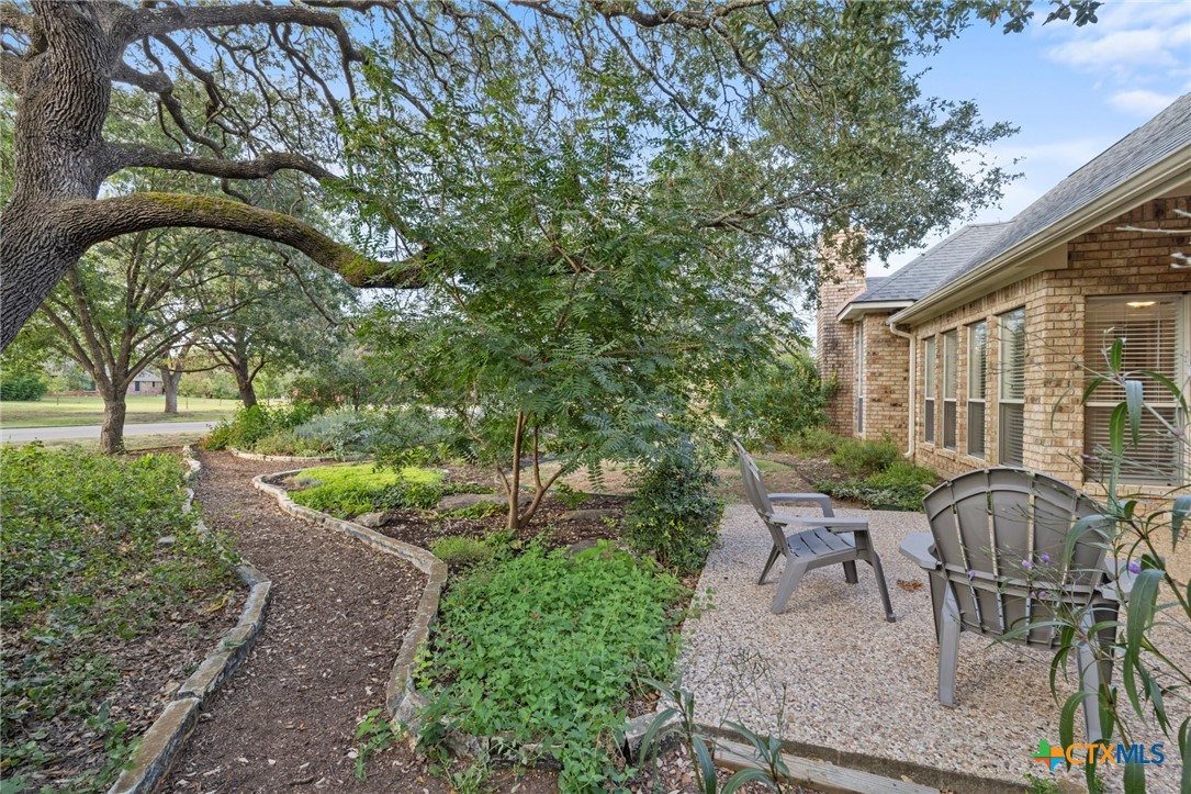 707 Livingston Court Temple, TX 76502 - Photo 31 of 36 a view of backyard with outdoor seating and green space