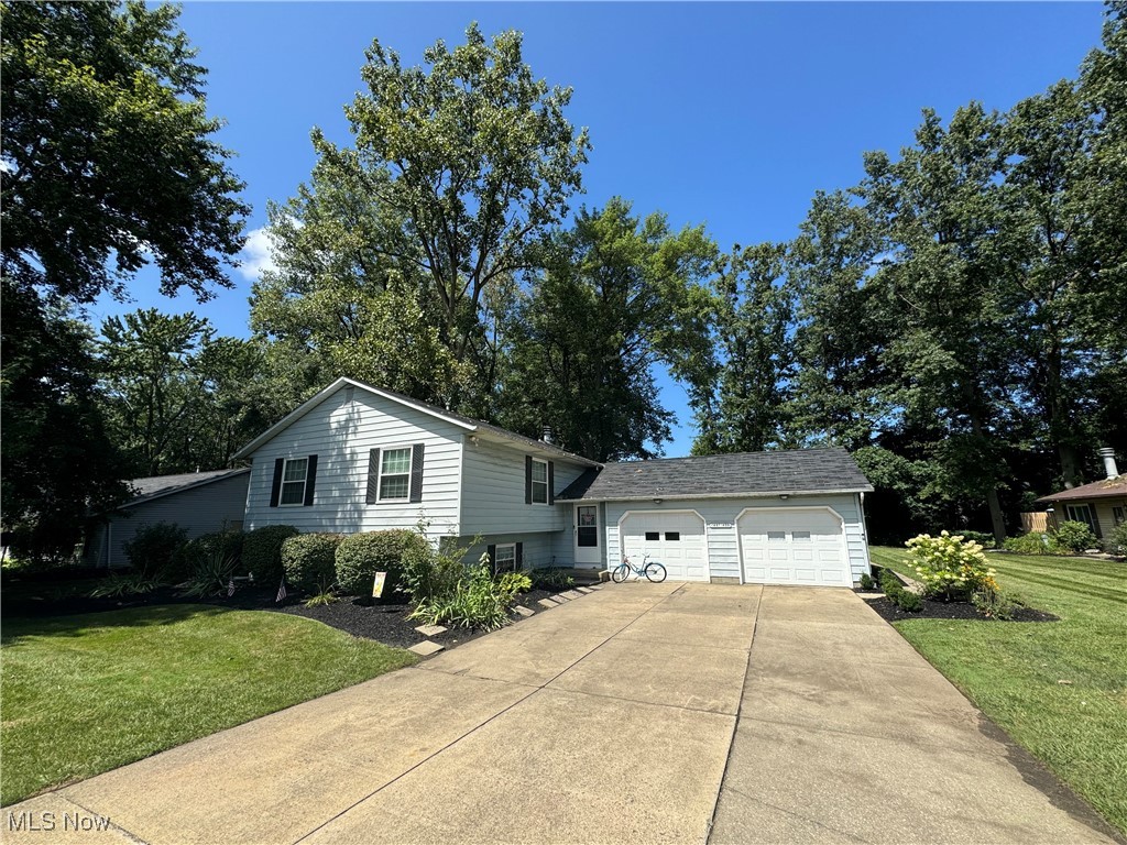 1499 Welch Road Painesville, OH 44077 - Photo 2 of 22 View of front of property featuring a side yard
