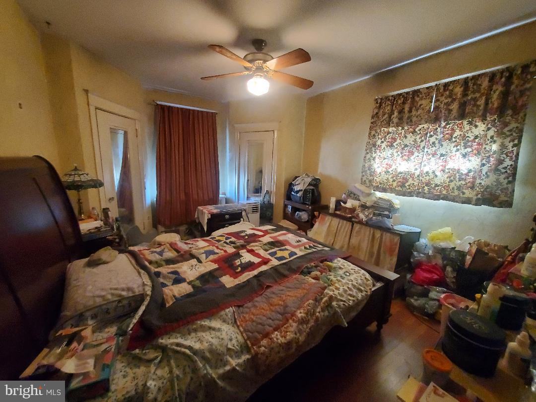 207 Avon Road Upper Darby, PA 19082 - Photo 20 of 29 a bed room with a bed and a couch