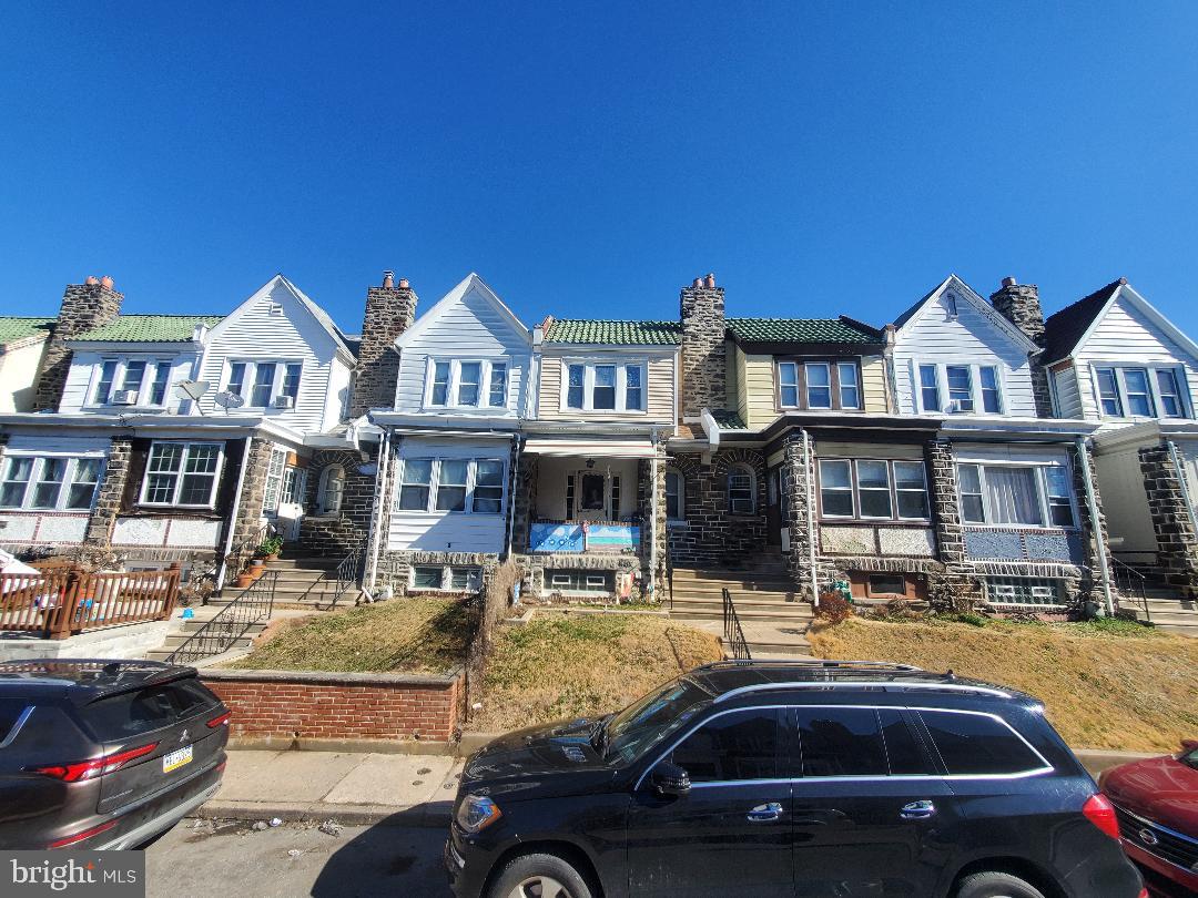 207 Avon Road Upper Darby, PA 19082 - Photo 5 of 29 a front view of residential houses with yard