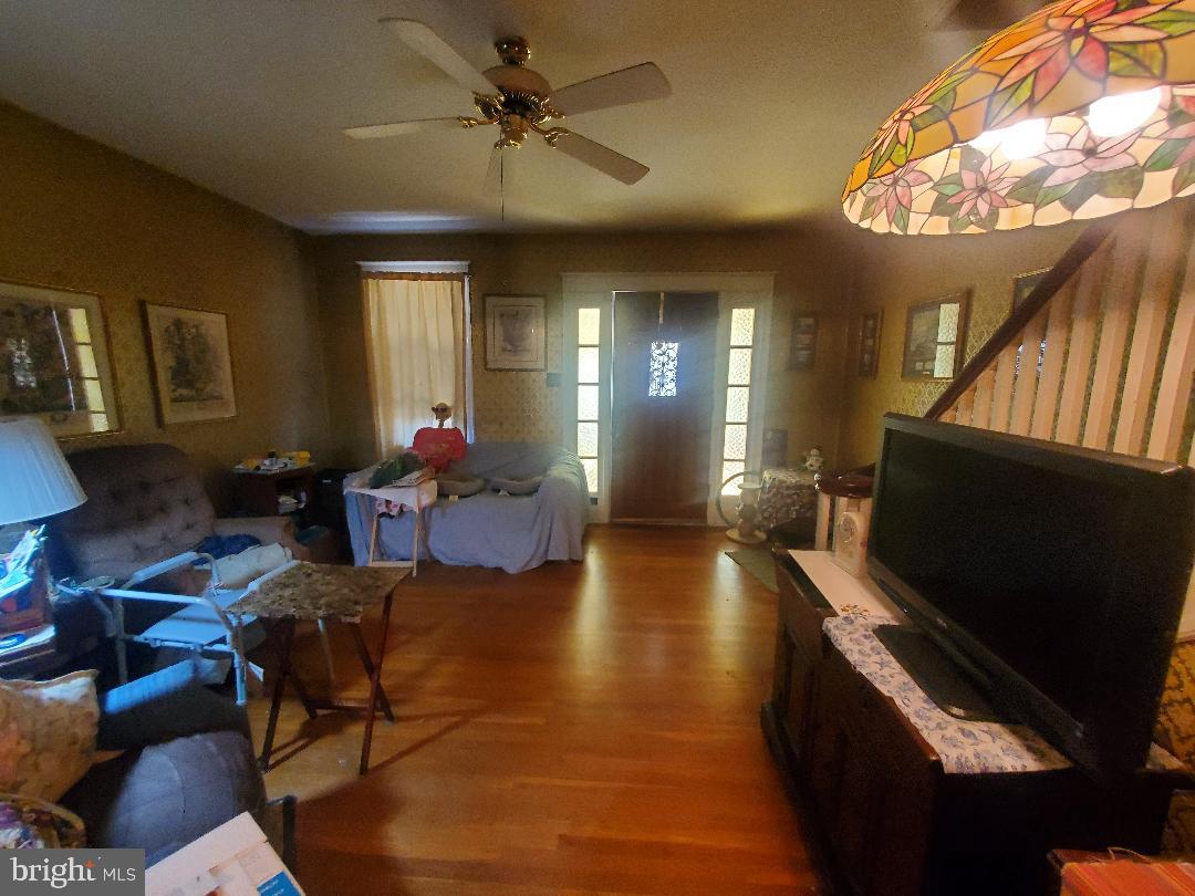 207 Avon Road Upper Darby, PA 19082 - Photo 8 of 29 a living room with furniture and a flat screen tv