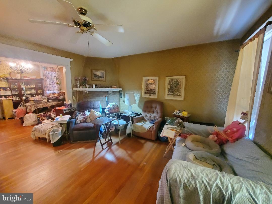 207 Avon Road Upper Darby, PA 19082 - Photo 9 of 29 a living room with furniture chess board and a window