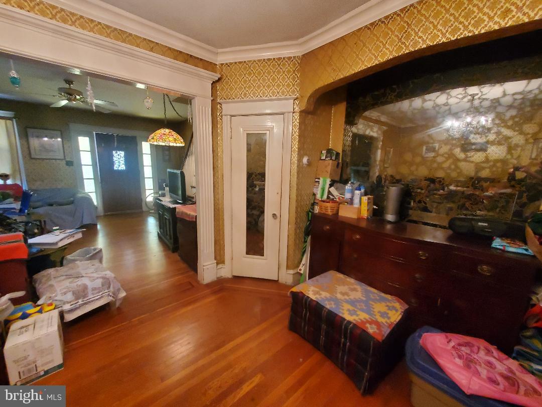 207 Avon Road Upper Darby, PA 19082 - Photo 10 of 29 a living room with furniture and a floor to ceiling window