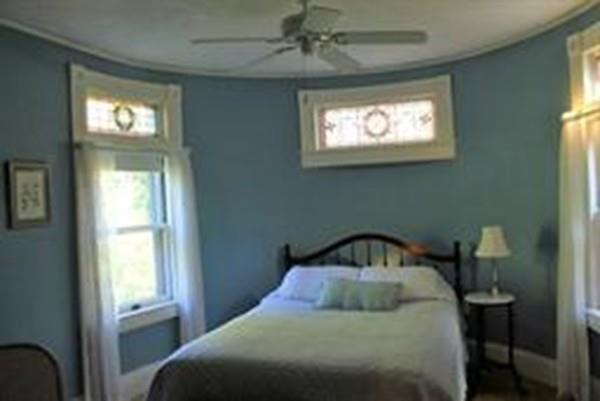 23 Washington Road Springfield, MA 01108 - Photo 27 of 40 a bedroom with a bed and window