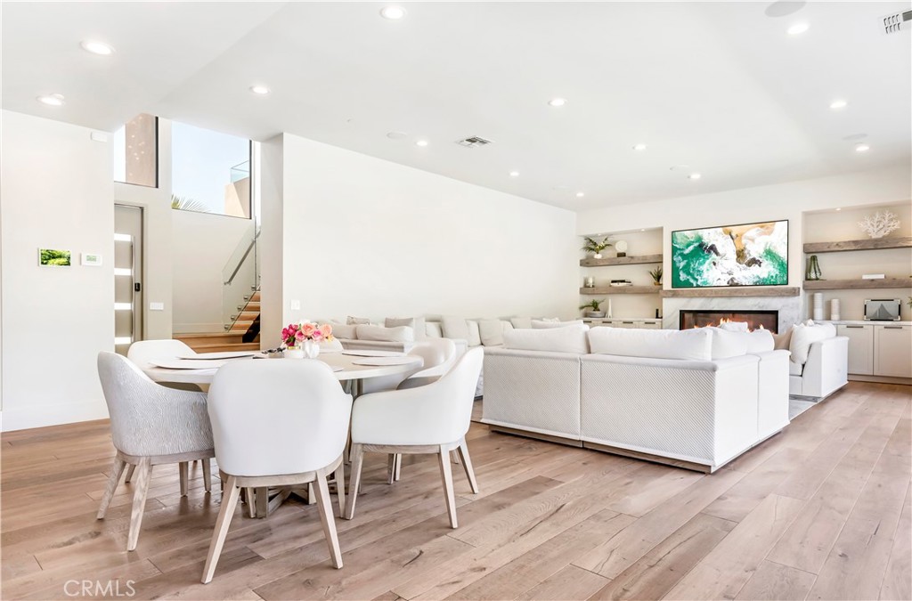 660 Kings Road Newport Beach, CA 92663 - Photo 15 of 41 a view of a dining room with furniture window and wooden floor