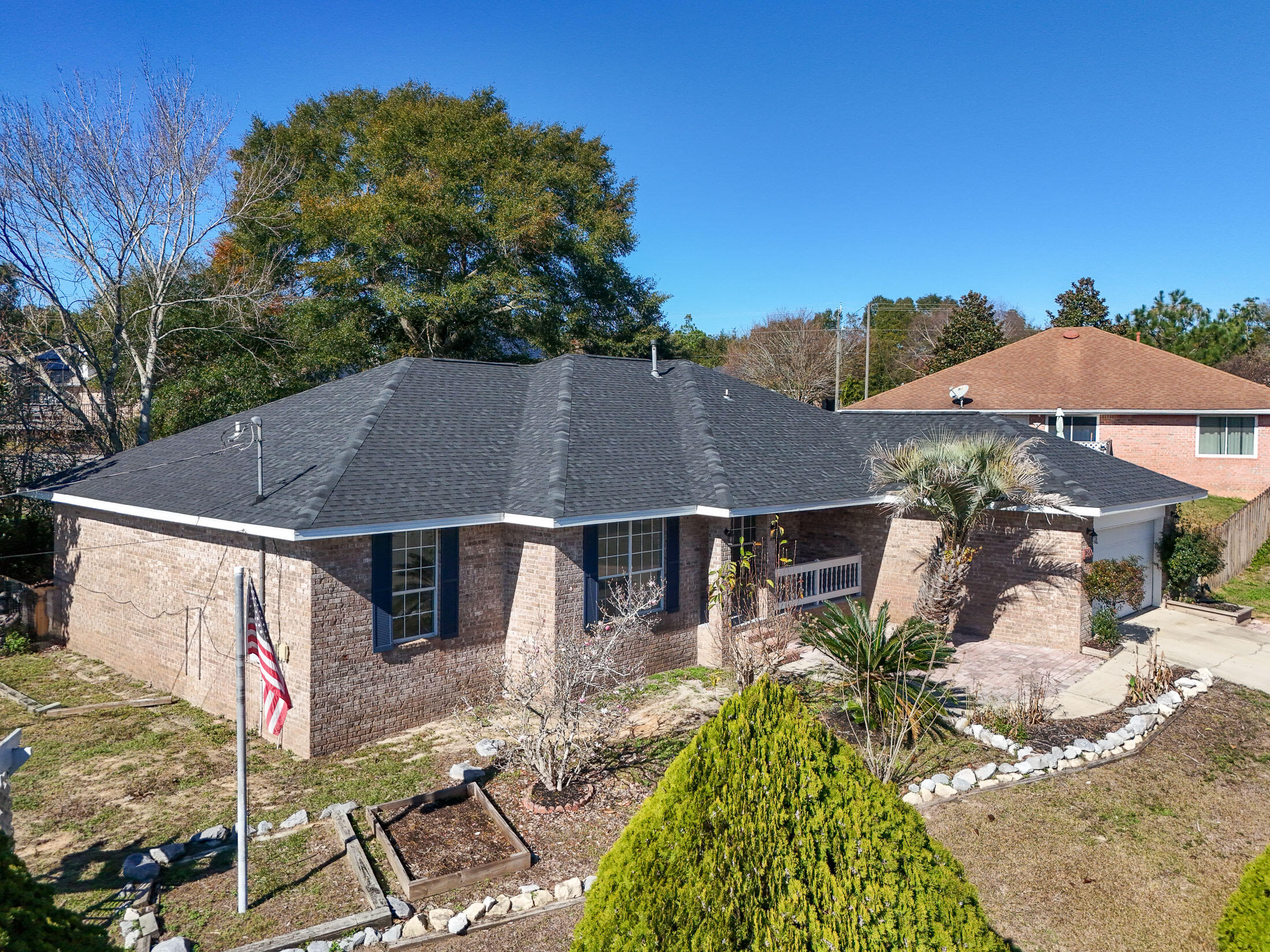 5200 Whitehurst Lane Crestview, FL 32536 - Photo 1 of 49 a aerial view of a house with table and chairs under an umbrella
