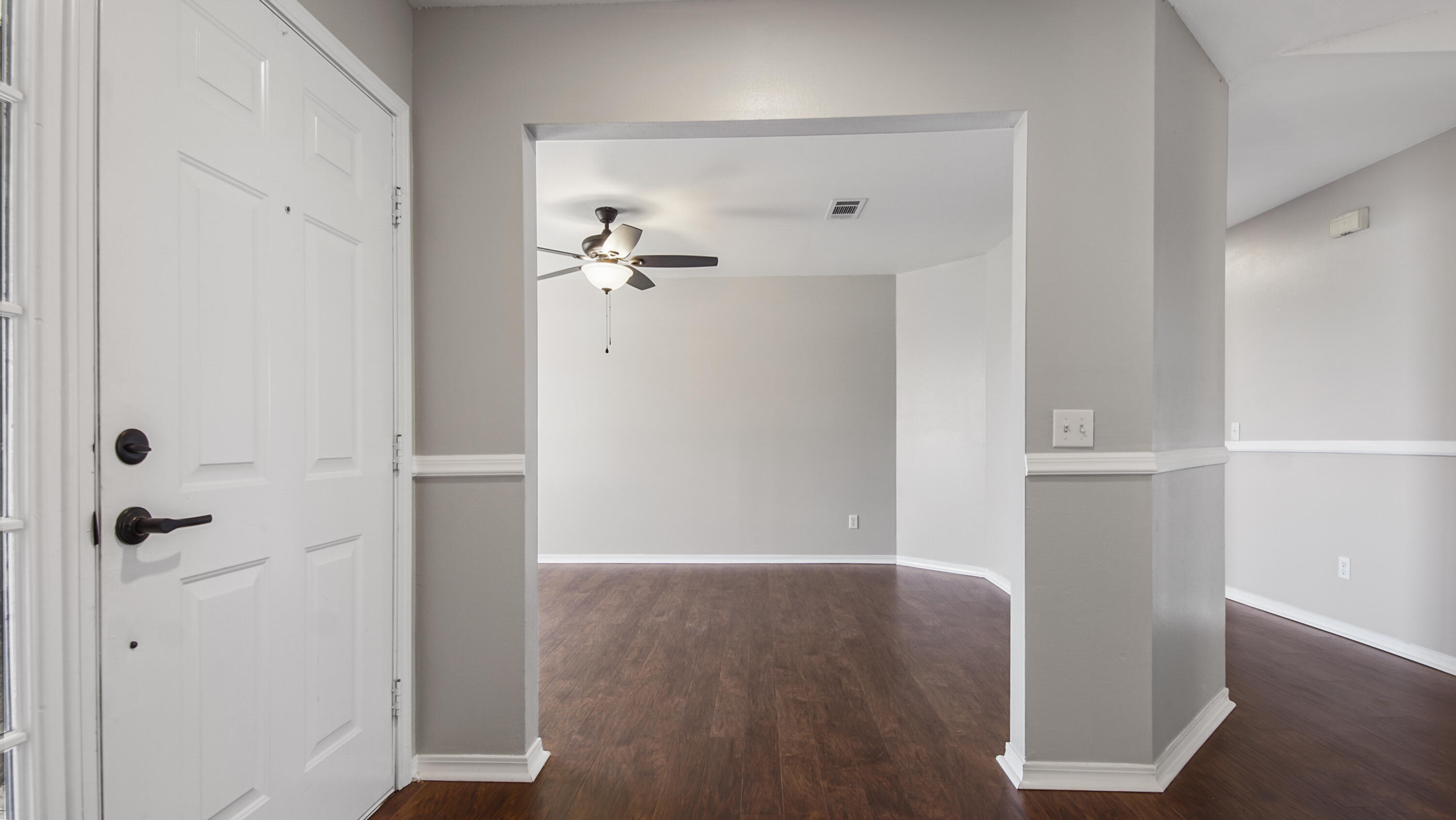 5200 Whitehurst Lane Crestview, FL 32536 - Photo 15 of 49 an empty room with wooden floor
