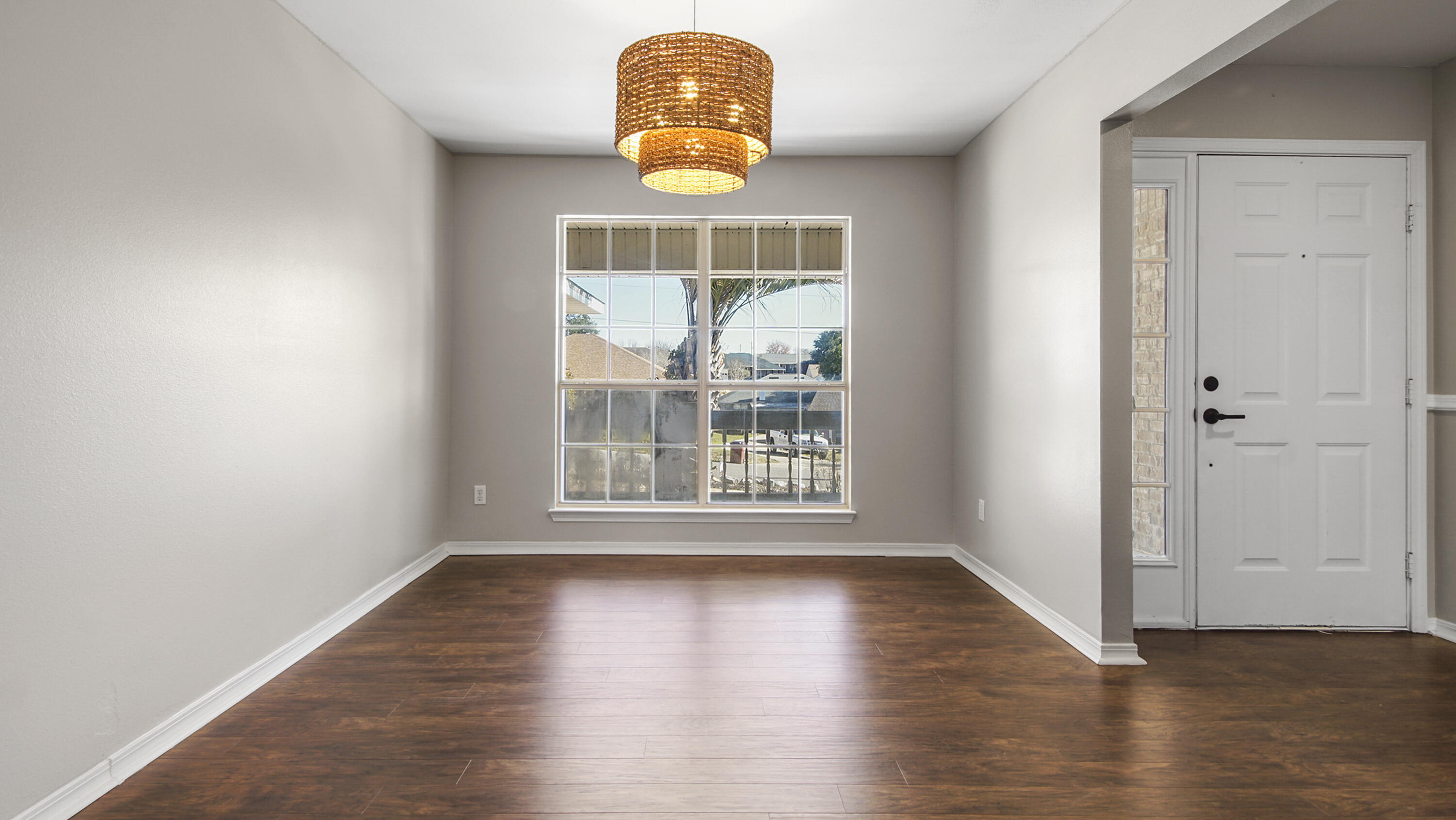 5200 Whitehurst Lane Crestview, FL 32536 - Photo 18 of 49 an empty room with wooden floor and windows
