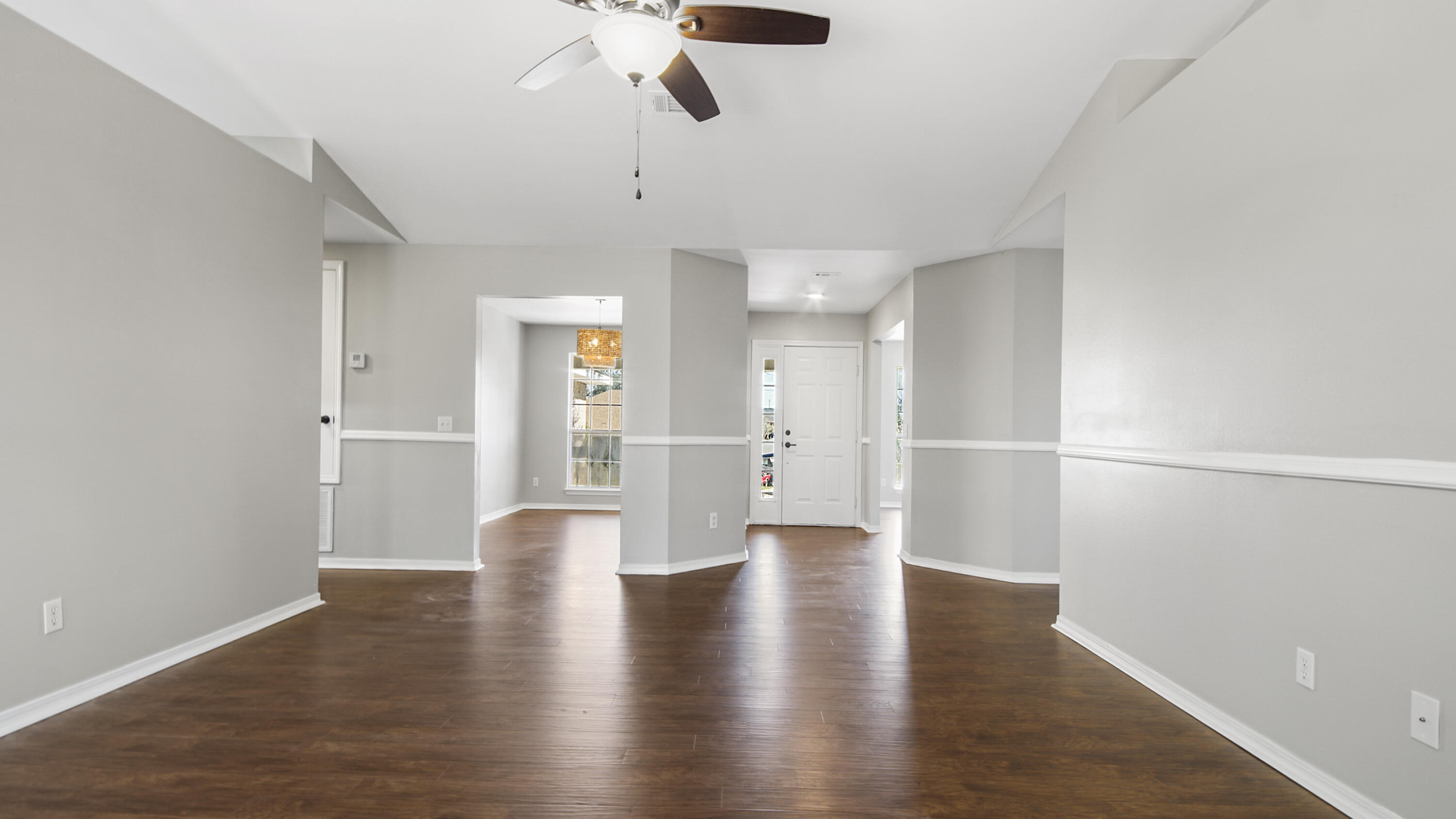 5200 Whitehurst Lane Crestview, FL 32536 - Photo 19 of 49 a view of an empty room with wooden floor