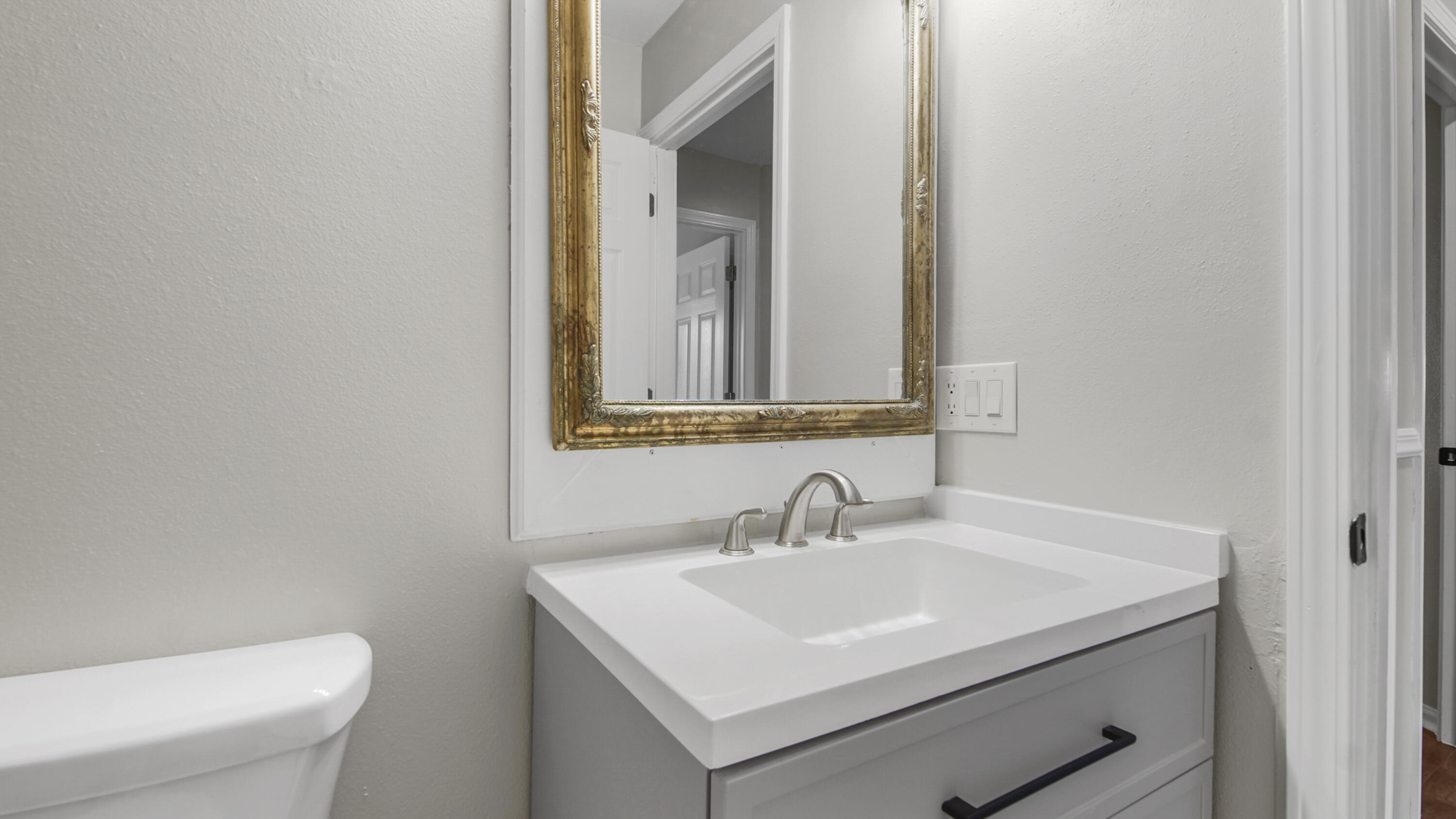 5200 Whitehurst Lane Crestview, FL 32536 - Photo 25 of 49 a bathroom with a sink toilet and mirror