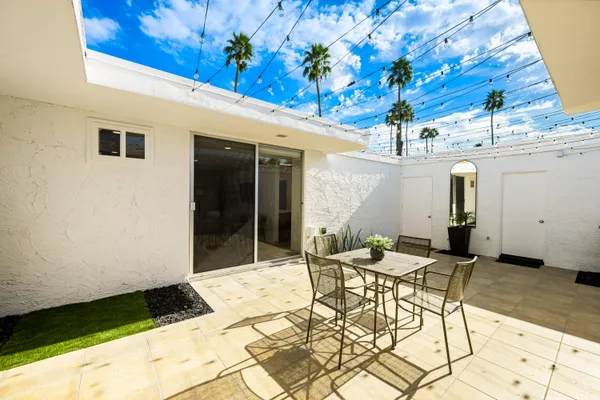 a bathroom with a sink double vanity granite and a mirror