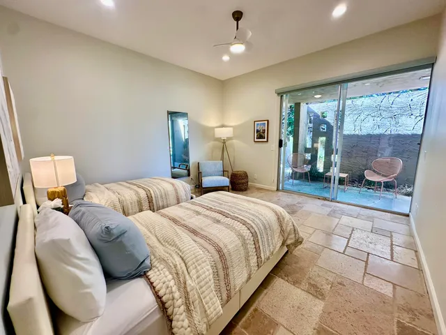 a bedroom with double bed and a window