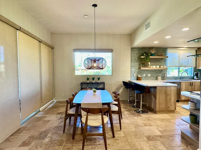 a view of a dining room with furniture