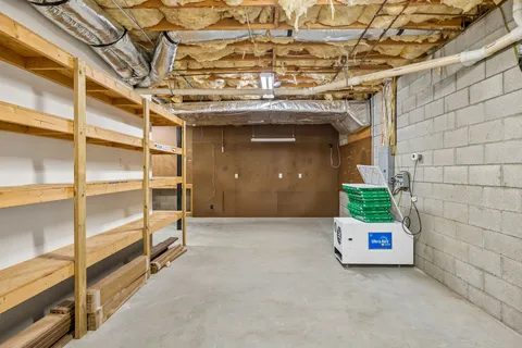 a view of an empty room with a staircase