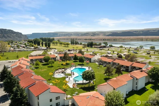 a view of a lake with a house in the background