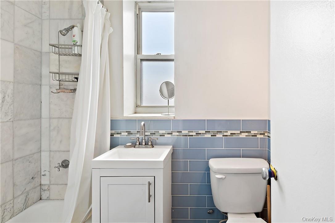 4320 Van Cortlandt Park East, Unit 6B Bronx, NY 10470 - Photo 13 of 19 a bathroom with a sink toilet and shower