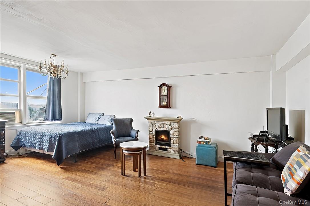 4320 Van Cortlandt Park East, Unit 6B Bronx, NY 10470 - Photo 8 of 19 a living room with furniture and a chandelier