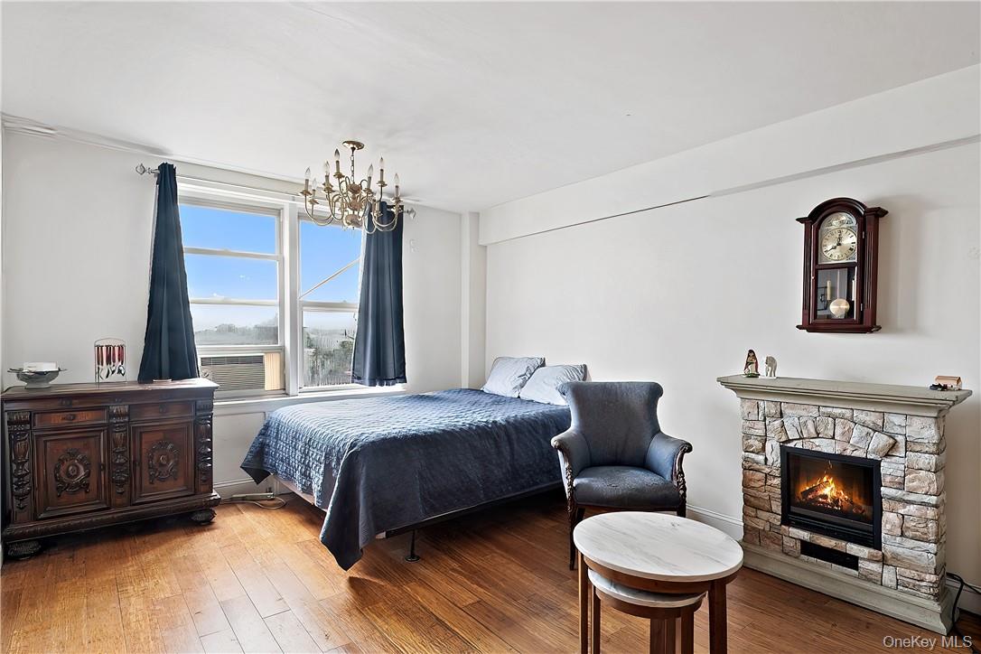 4320 Van Cortlandt Park East, Unit 6B Bronx, NY 10470 - Photo 9 of 19 a bedroom with a bed and a fireplace