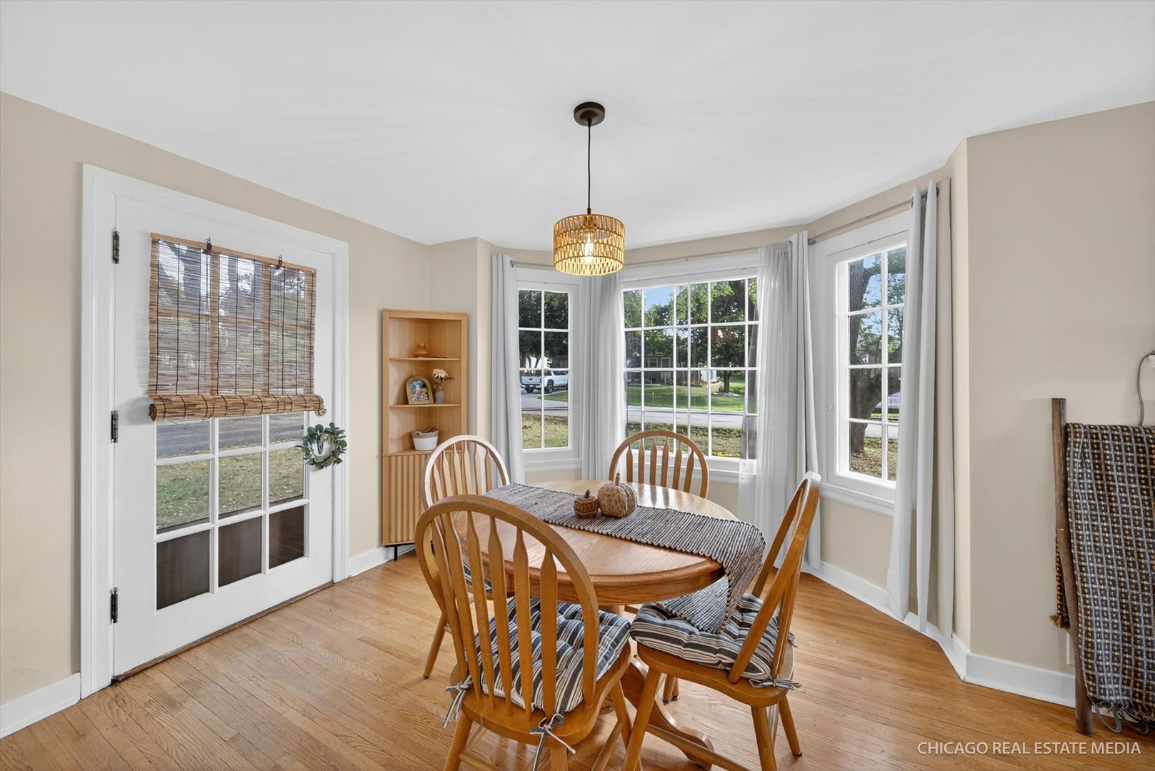 844 Bode Road Elgin, IL 60120 - Photo 6 of 34 a view of a dining room with furniture window and wooden floor