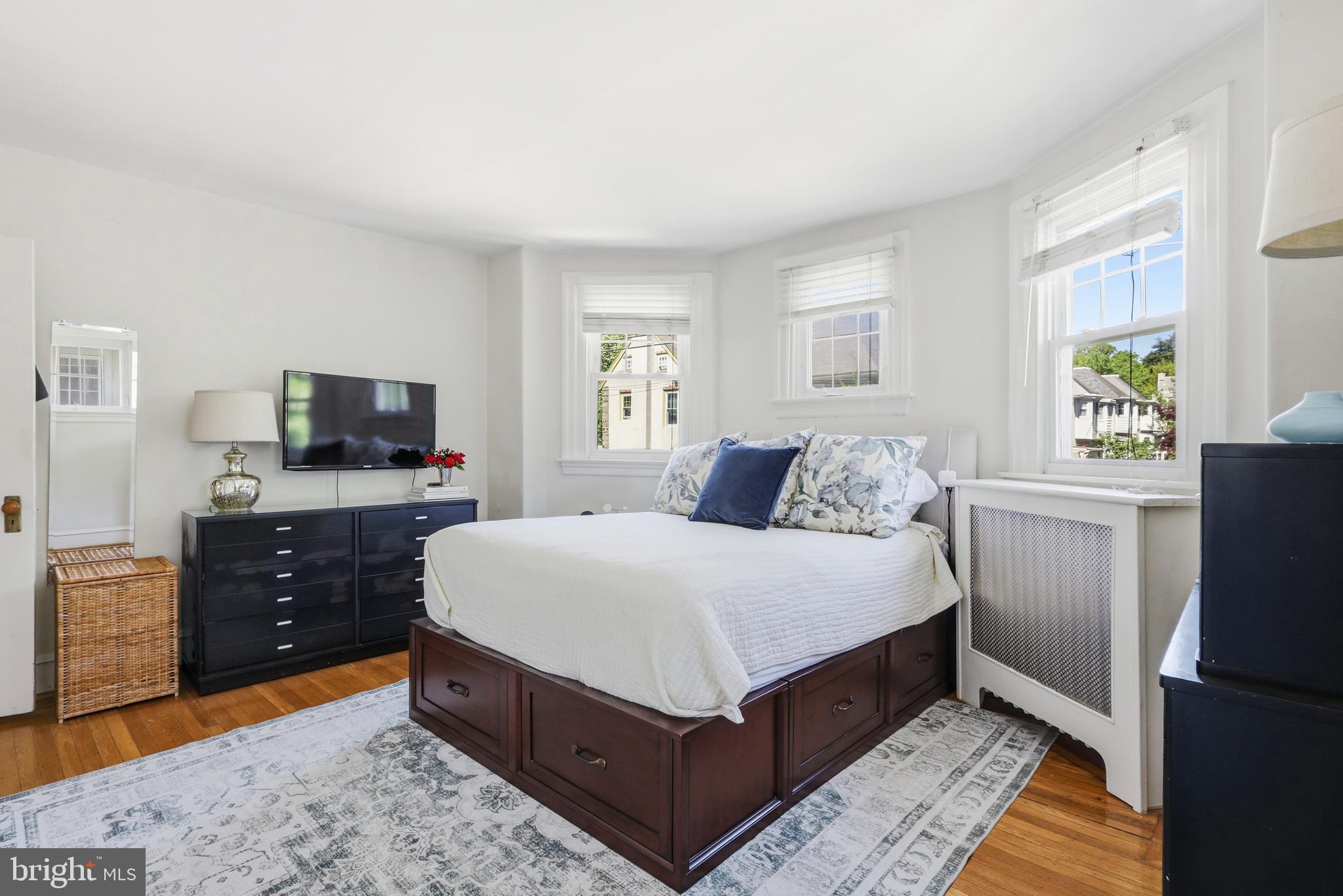 307 East Gravers Lane Philadelphia, PA 19118 - Photo 24 of 44 a spacious bedroom with a bed and a flat screen tv