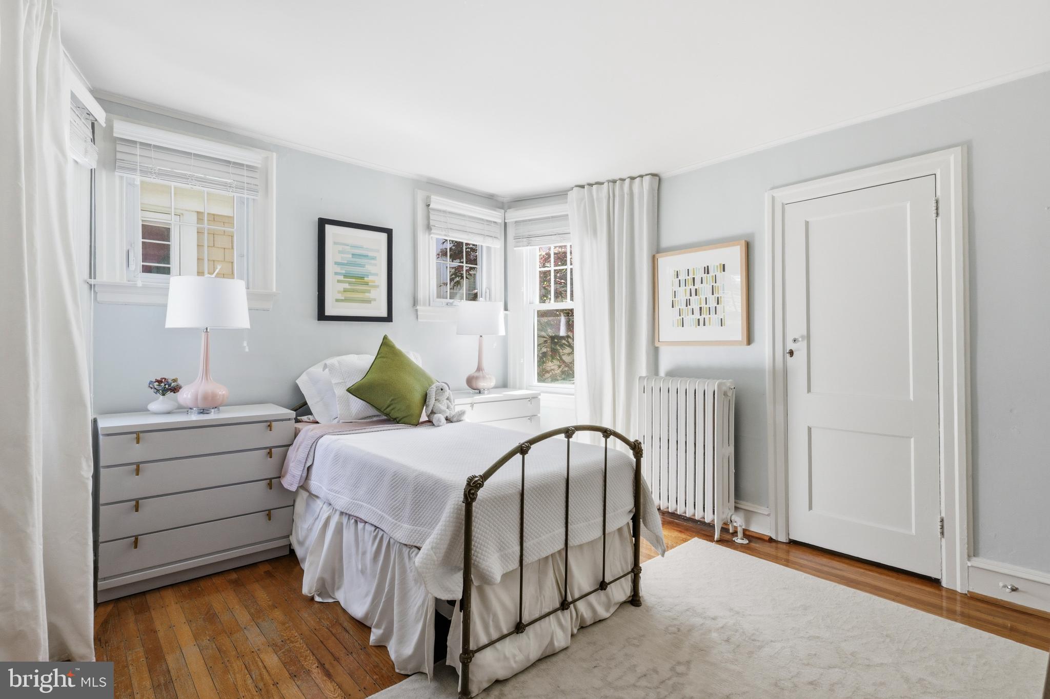 307 East Gravers Lane Philadelphia, PA 19118 - Photo 25 of 44 a bedroom with a beds and painting on the wall