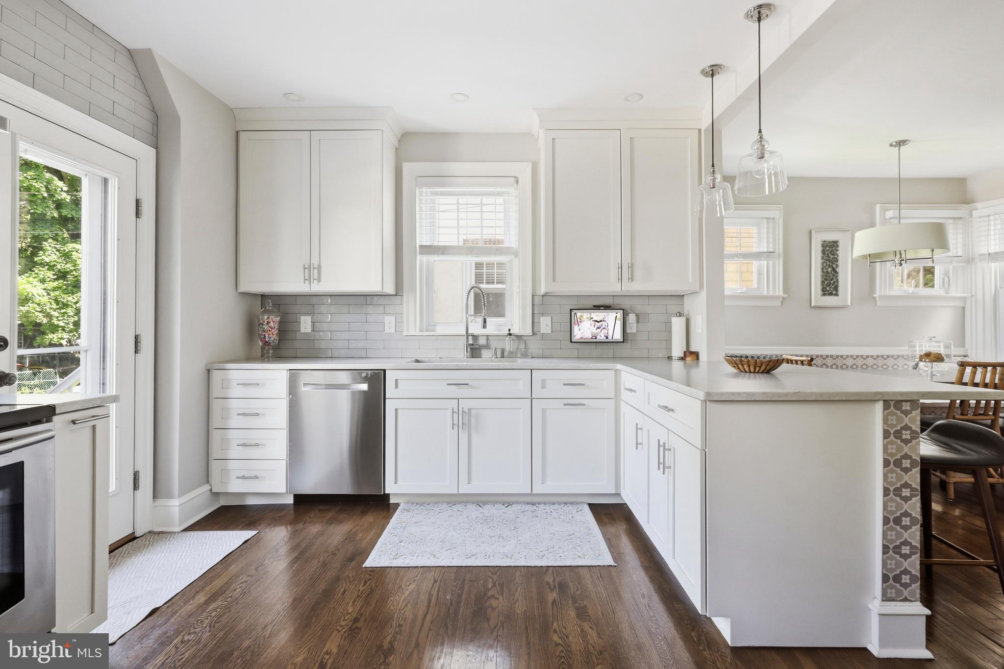 307 East Gravers Lane Philadelphia, PA 19118 - Photo 8 of 44 a kitchen with white cabinets sink and white appliances