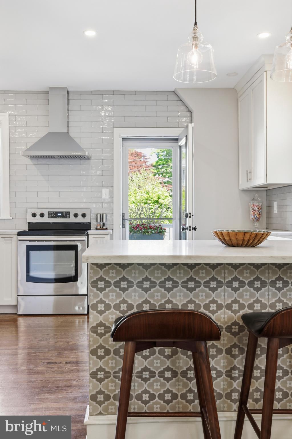 307 East Gravers Lane Philadelphia, PA 19118 - Photo 10 of 44 a kitchen with stainless steel appliances granite countertop a stove a sink and a microwave