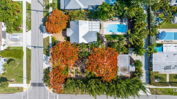 an aerial view of residential house with outdoor space and street view