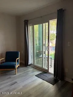 a view of a livingroom with furniture and front door