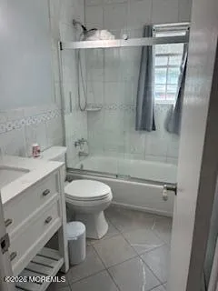 a bathroom with a toilet a sink and bathtub