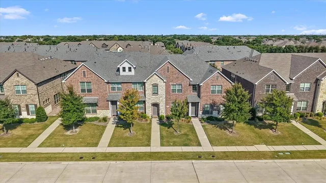 a view of houses with an outdoor space and lakeside