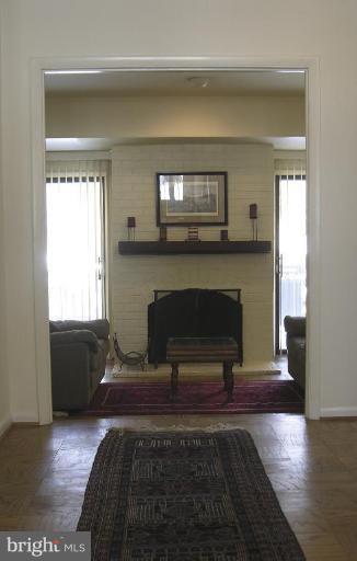 11820 Grey Birch Place Reston, VA 20191 - Photo 2 of 20 a living room with furniture and a fireplace