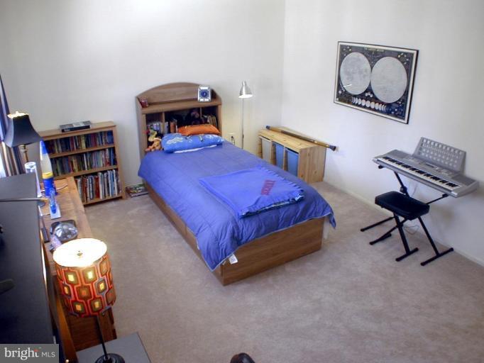 11820 Grey Birch Place Reston, VA 20191 - Photo 13 of 20 a bedroom with a bed and dresser