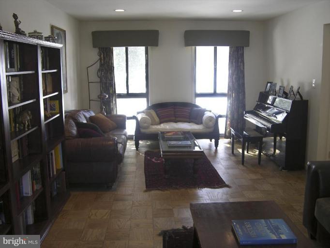 11820 Grey Birch Place Reston, VA 20191 - Photo 7 of 20 a living room with furniture and floor to ceiling windows