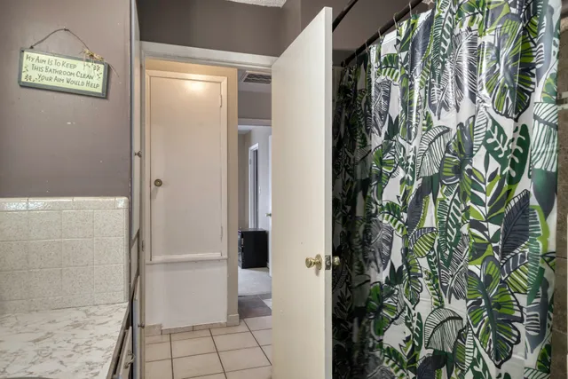 a bathroom with a toilet and shower